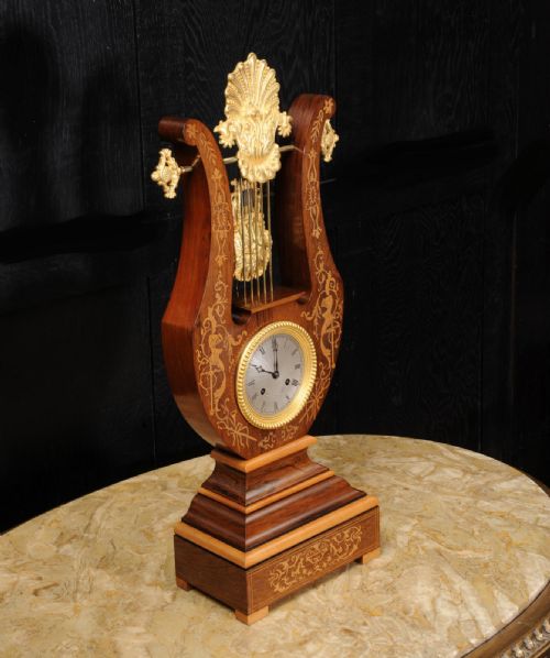 fig 4.
Rosewood Marquetry and Ormolu Lyre Clock with Mystery Pendulum - Henri Marc