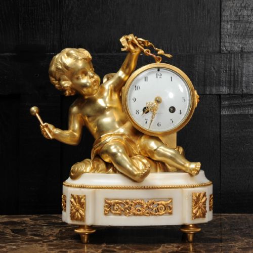fig 1. Ormolu and White Marble Clock ~ Putto Floating in Clouds Playing a Drum Antique French