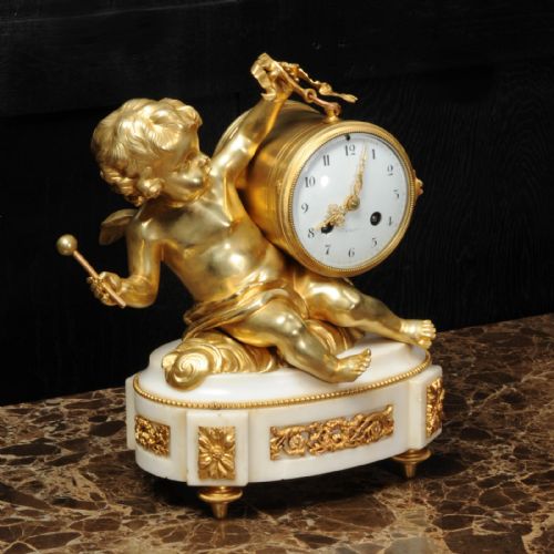 fig 3. Ormolu and White Marble Clock ~ Putto Floating in Clouds Playing a Drum Antique French
