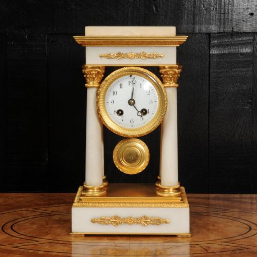 fig 1. Antique French Ormolu and White Marble Portico Clock