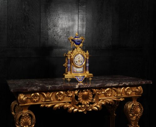 fig 6. A Louis XVI style French ormolu and cobalt blue hand-painted porcelain mantel clock topped with an urn finial.