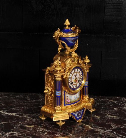 fig 7. A Louis XVI style French ormolu and cobalt blue hand-painted porcelain mantel clock topped with an urn finial.