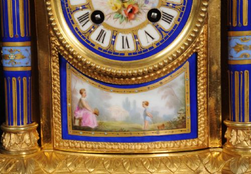A Louis XVI style French ormolu and cobalt blue hand-painted porcelain mantel clock topped with an urn finial. View XII