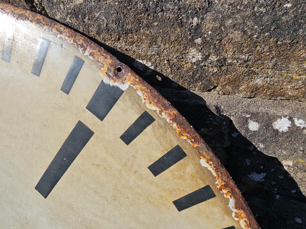 A large circular off-white enamelled turret clock dial featuring black Roman numerals and the maker name Joyce Whitchurch. View VI