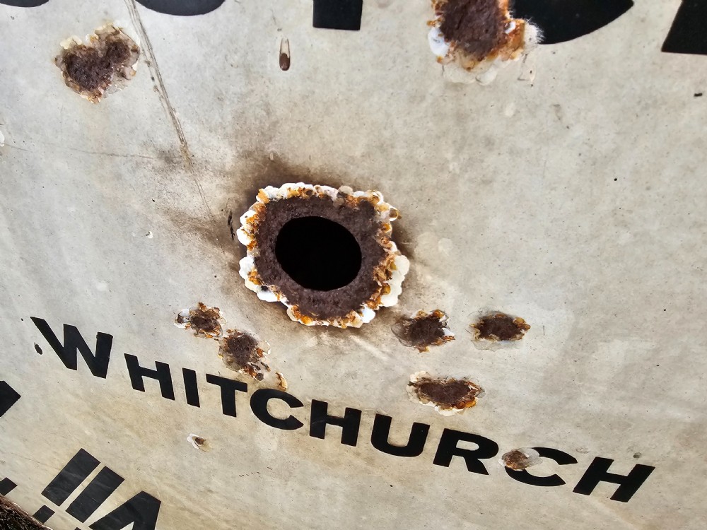 A large circular off-white enamelled turret clock dial featuring black Roman numerals and the maker name Joyce Whitchurch. View VIII