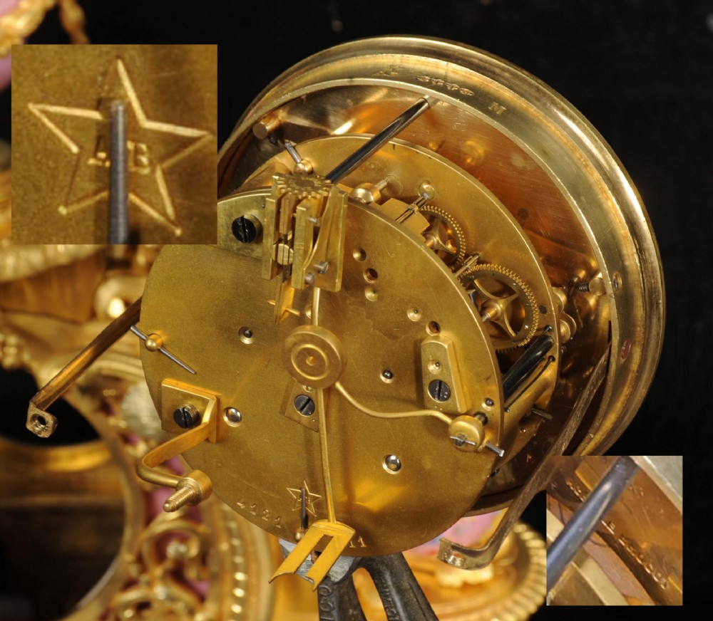 An ornate 19th-century French gilt-bronze and pink Sevres porcelain mantel clock featuring scrolled ormolu mounts and hand-painted cherubs. View XII