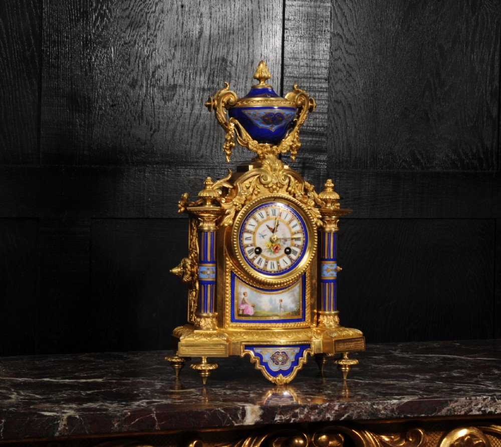 A Louis XVI style French ormolu and cobalt blue hand-painted porcelain mantel clock topped with an urn finial. View III