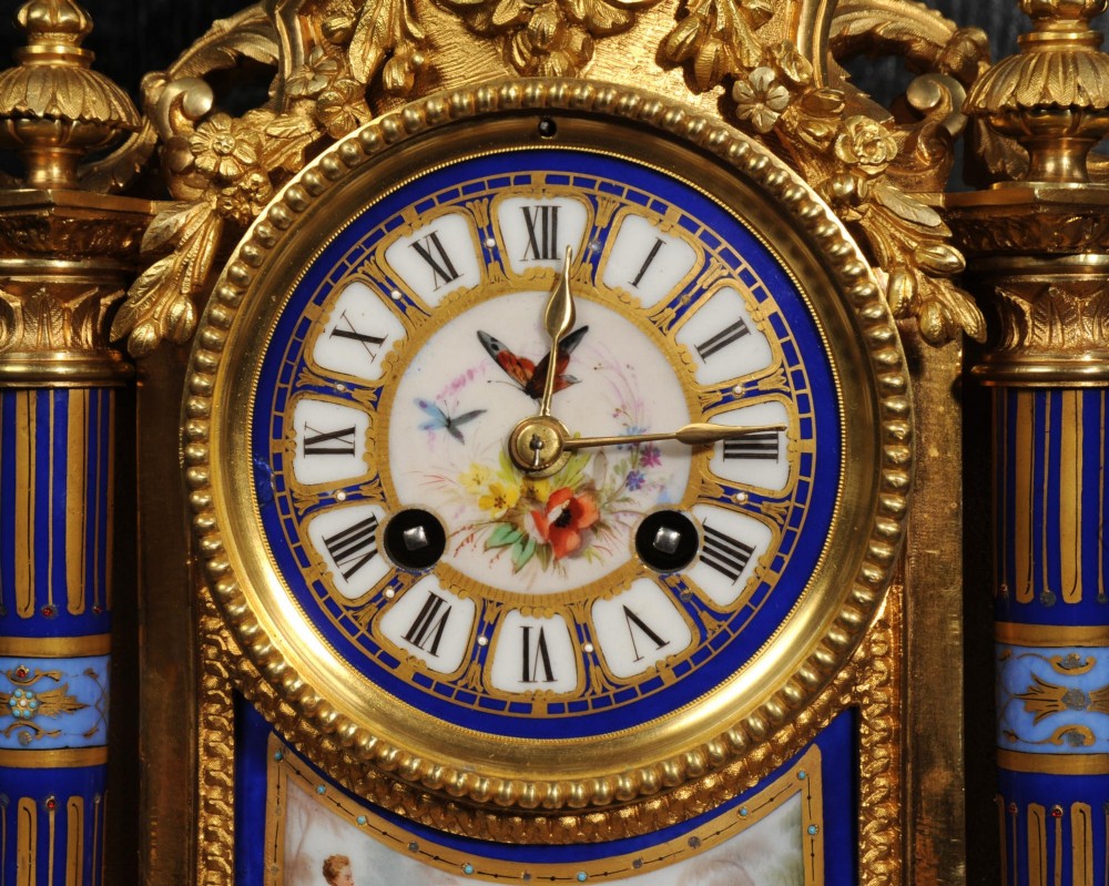 A Louis XVI style French ormolu and cobalt blue hand-painted porcelain mantel clock topped with an urn finial. View XI