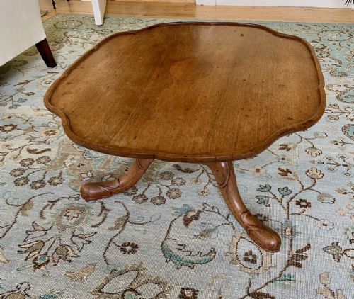 A WHYTOCK AND REID WALNUT COFFEE TABLE