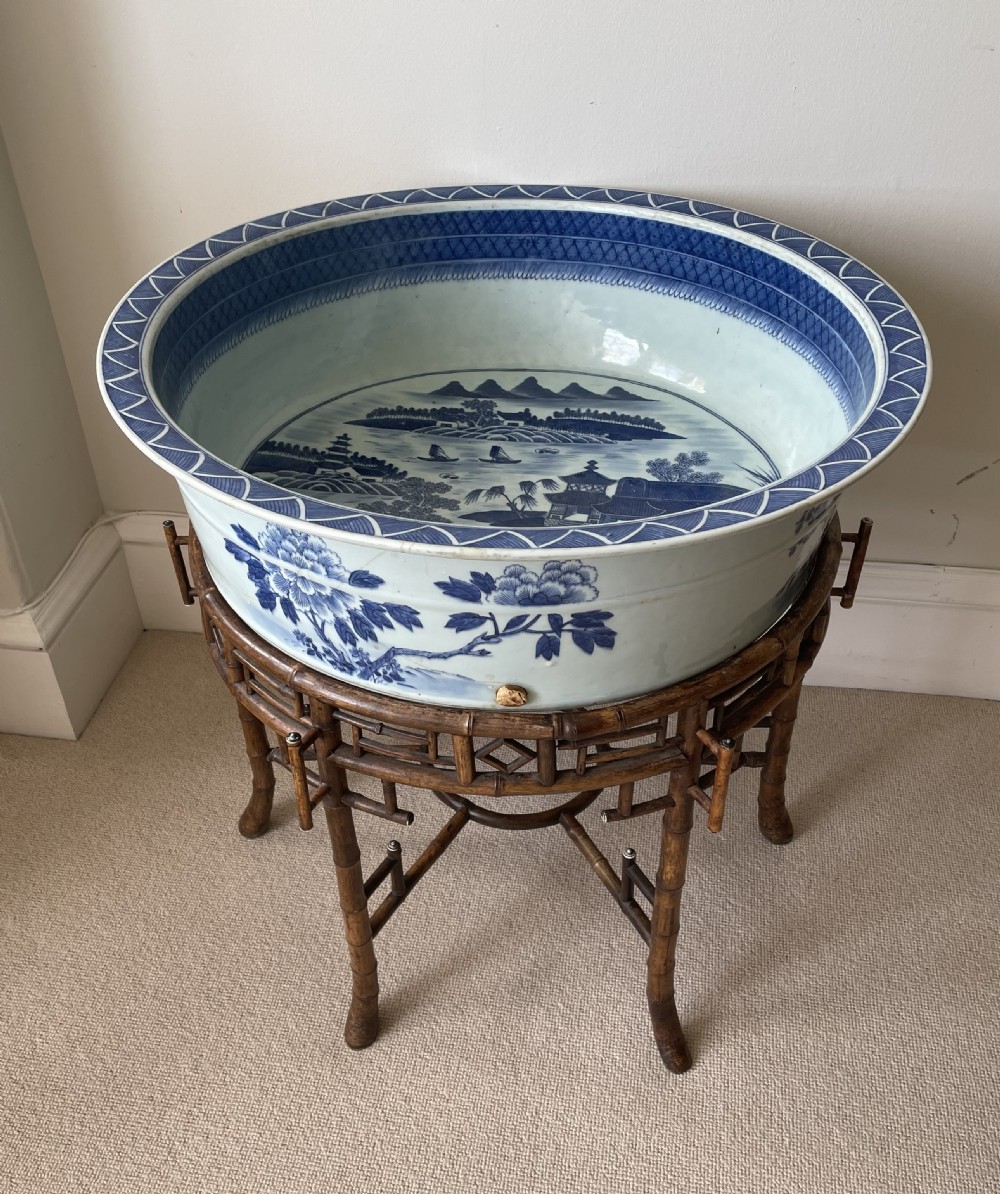 A large 19th c. Chinese blue and white bowl with bamboo stand.