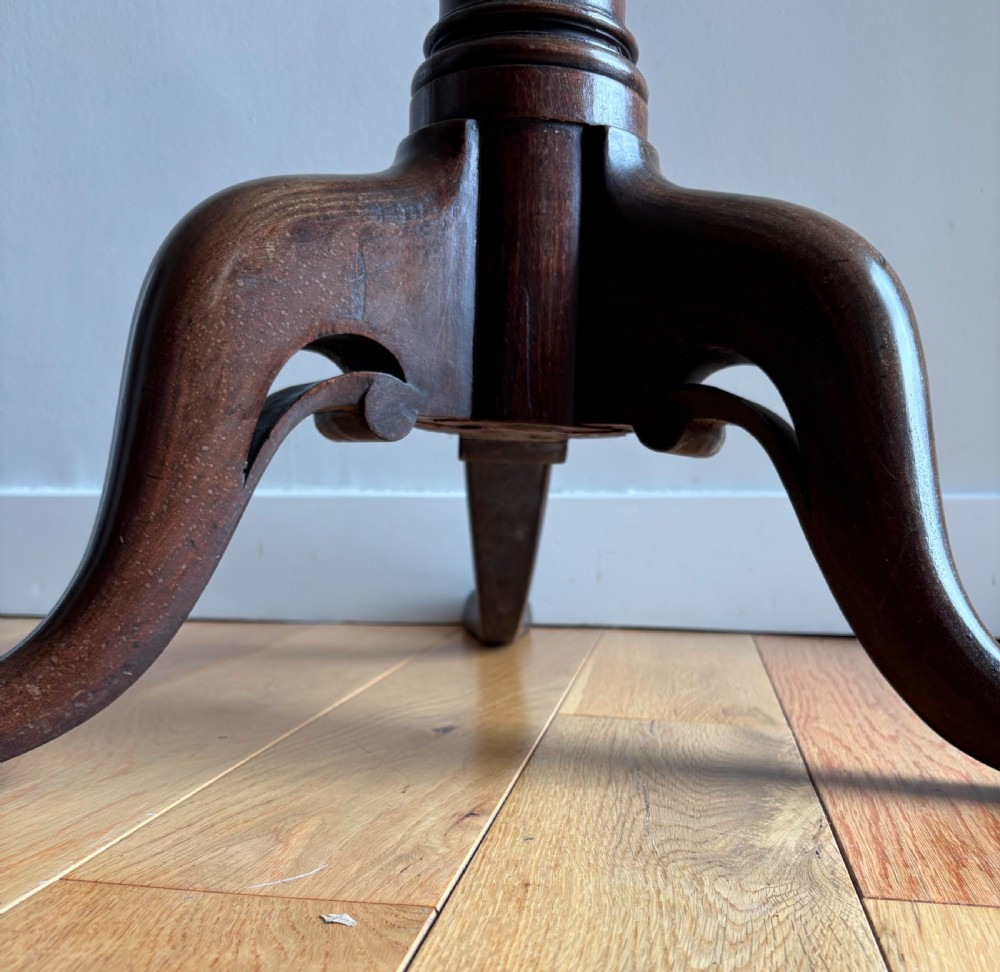 A circular Scottish George II mahogany occasional table featuring a single-piece turned pedestal column set on three cabriole legs with pad feet. View VIII
