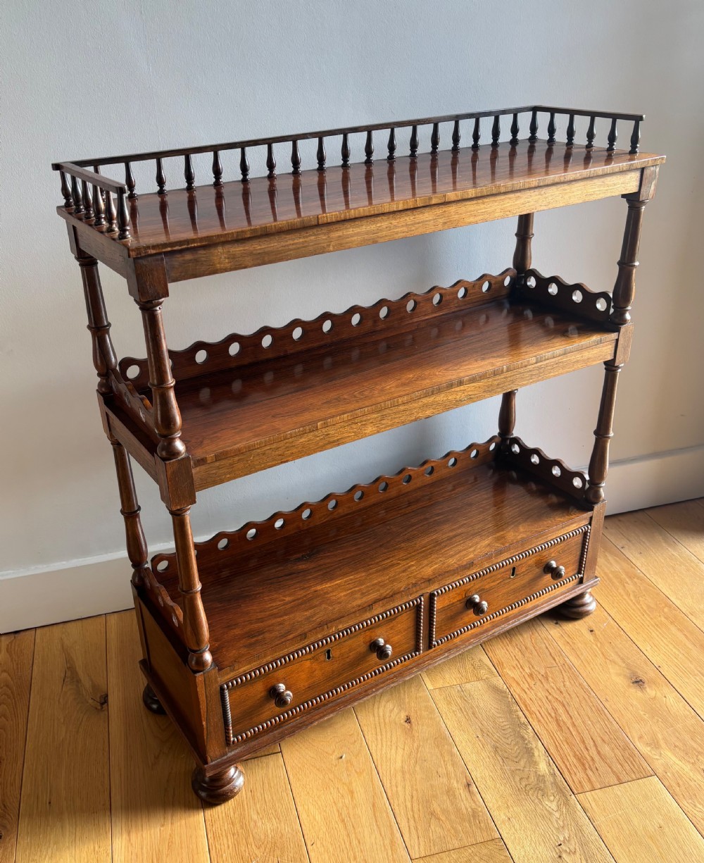 A late Regency rosewood dwarf bookcase View II