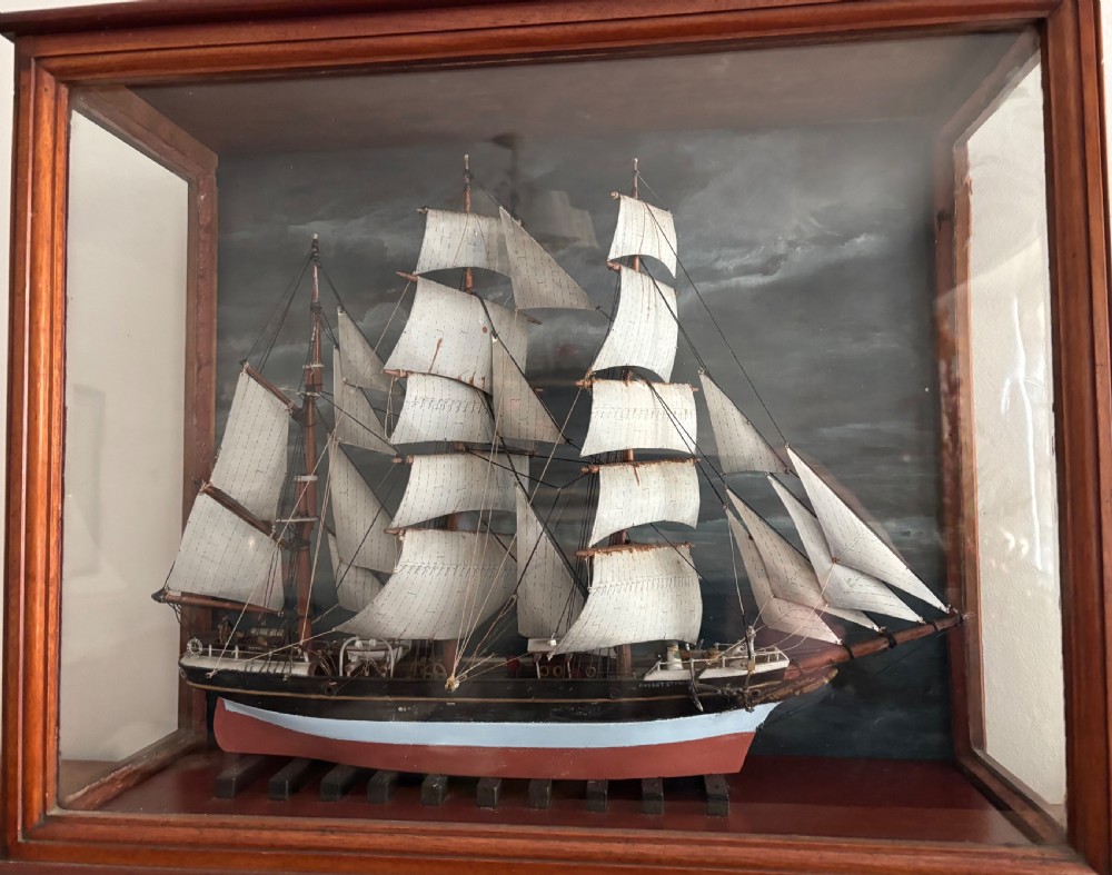 A detailed late Edwardian cased scale model of a three-masted barque sailing ship with full rigging, sails, and a painted hull. View III