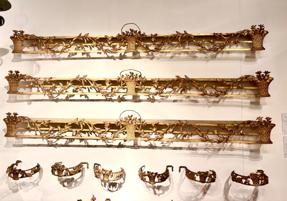 A rare set of 3 George III gilt wood pelmets with matching tie backs.
