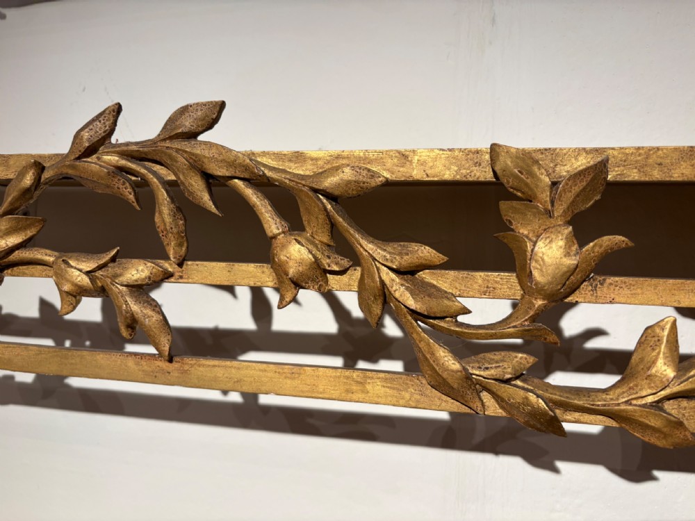 A rare set of 3 George III gilt wood pelmets with matching tie backs. View III