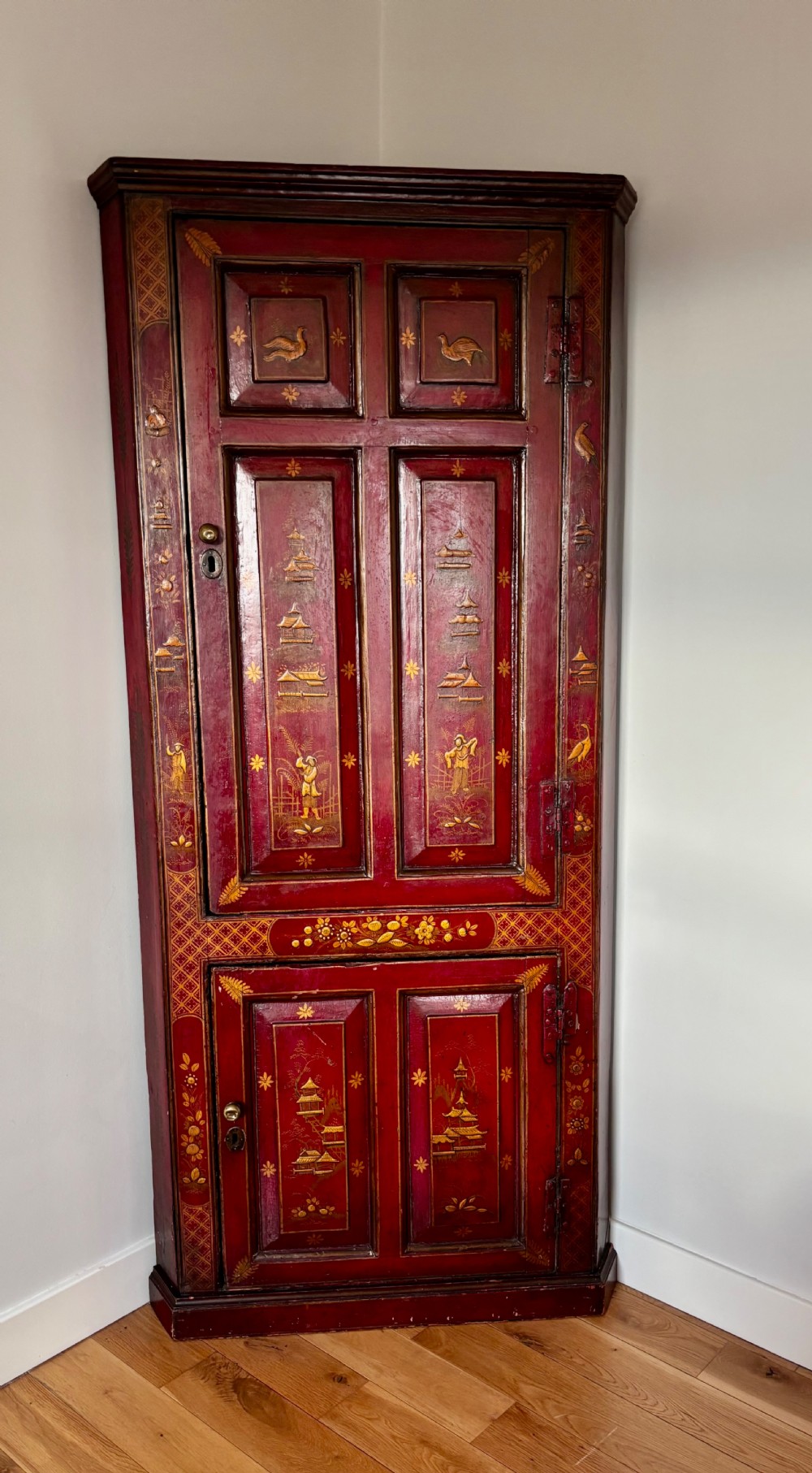 A George III red lacquer cabinet