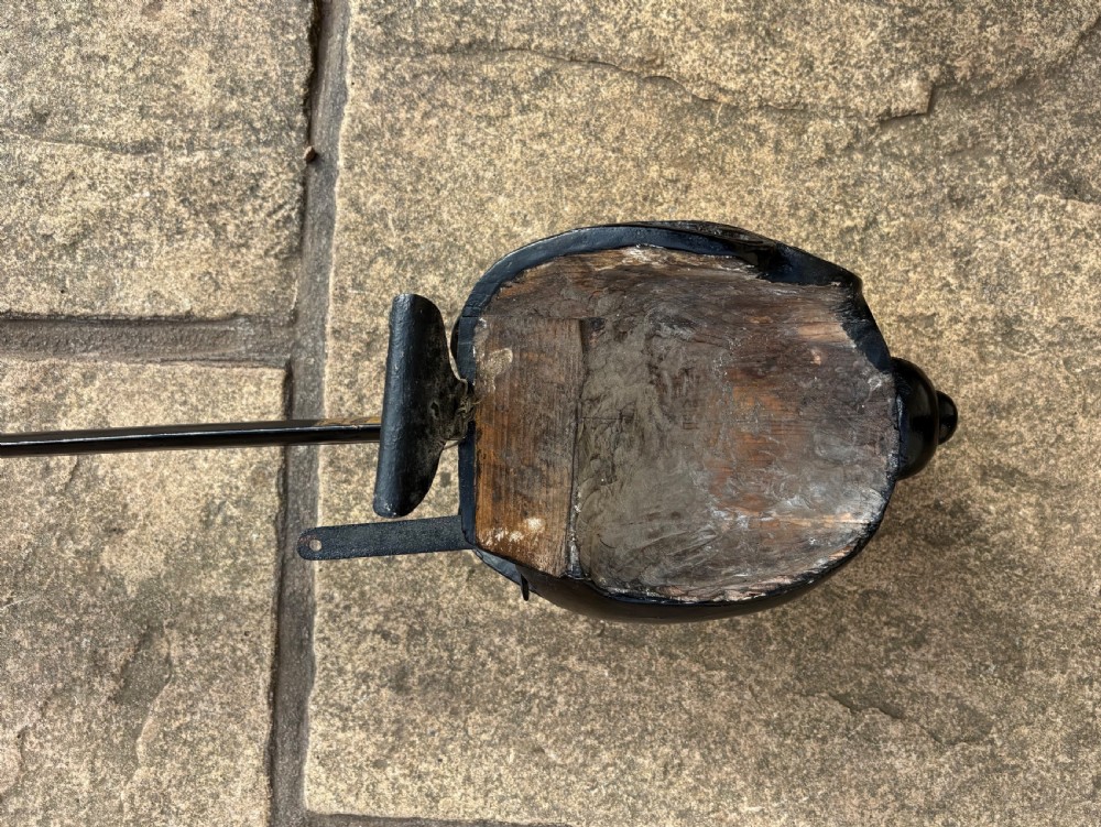 A Scottish wooden broadsword featuring a long dark blade and a basket guard lined with red leather. View VI