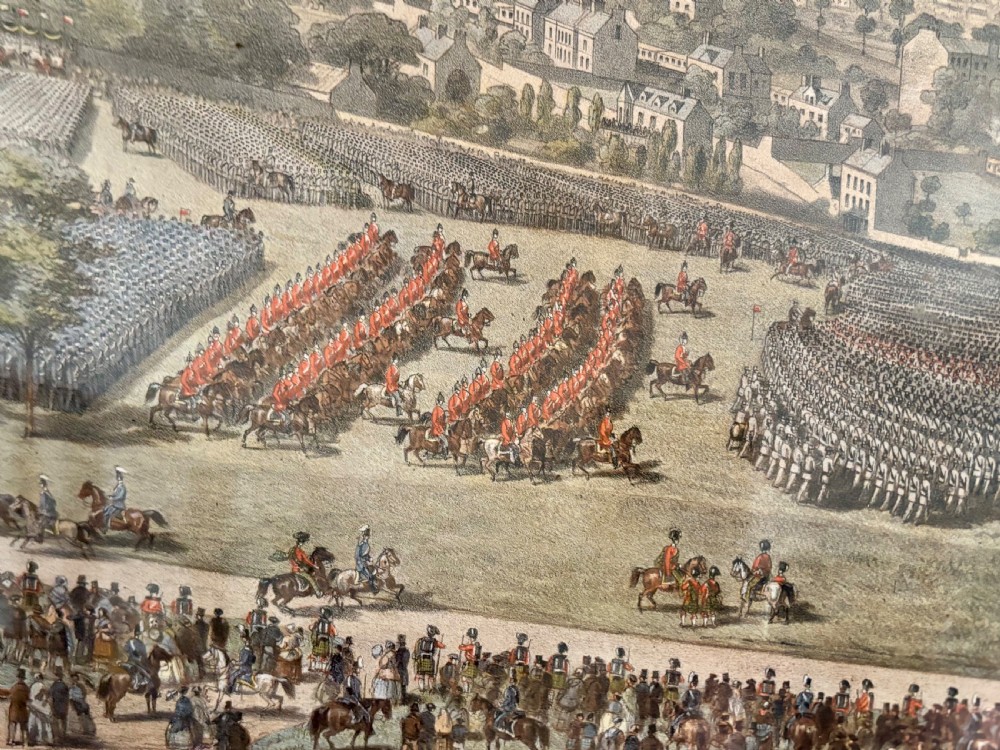 A framed Victorian military print depicting a panoramic view of the Royal Review of the Scottish Volunteers in a dark wooden frame with a gold slip. View IV