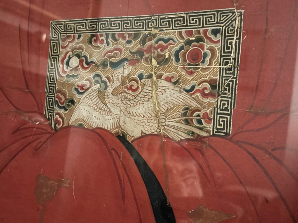 A framed pair of Chinese ancestor portraits depicting a male and female figure seated in formal official robes. View VI