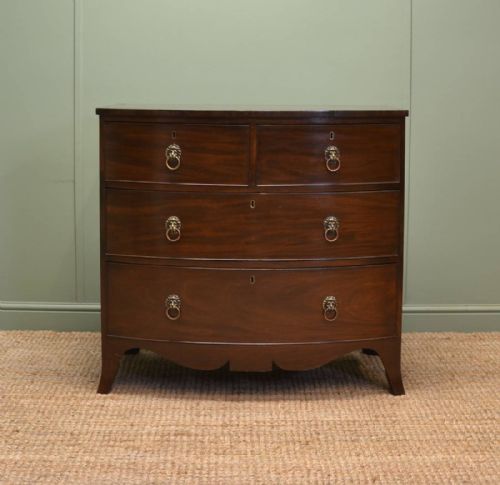 Fine Regency Mahogany Antique Bow Fronted Chest of Drawers with Lion Head Handles.