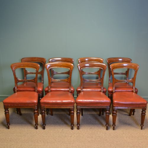 Country House Set of Eight Victorian Oak Balloon Back Antique Dining Chairs by James Winter & Sons.