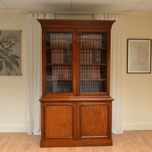Striking Glazed Figured Mahogany Antique Victorian Bookcase on Cupboard