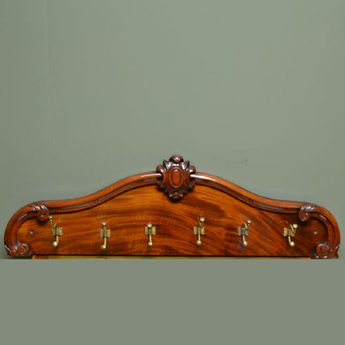 Victorian Brass Hooks on Beautifully Figured Mahogany Board