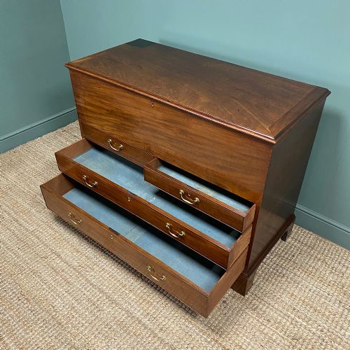 fig 3. A Georgian mahogany mule chest featuring a top hinged lid over two short drawers and two long drawers with brass swan-neck handles on bracket feet.