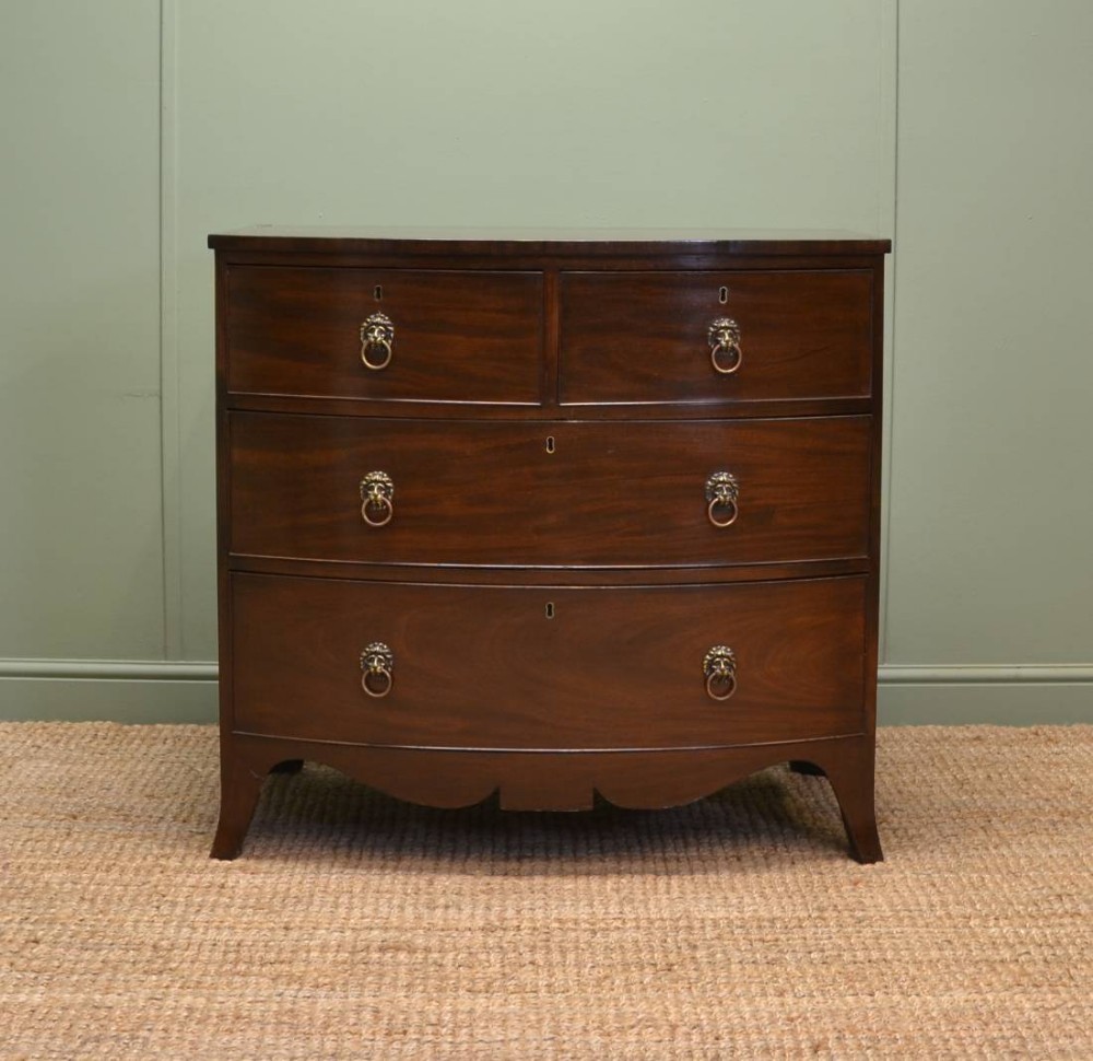 Fine Regency Mahogany Antique Bow Fronted Chest of Drawers with Lion Head Handles.