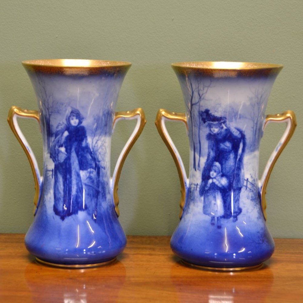 A Pair of Royal Doulton 'Blue Children' Vases