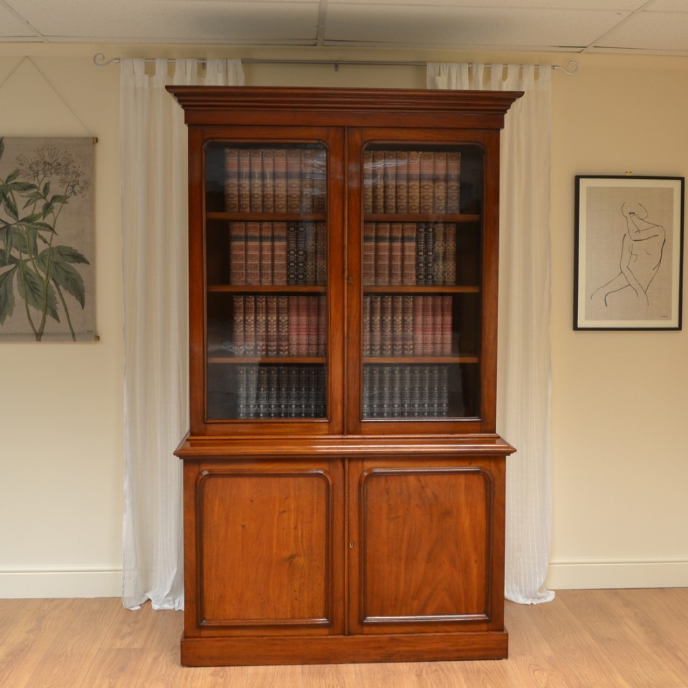 Striking Glazed Figured Mahogany Antique Victorian Bookcase on Cupboard