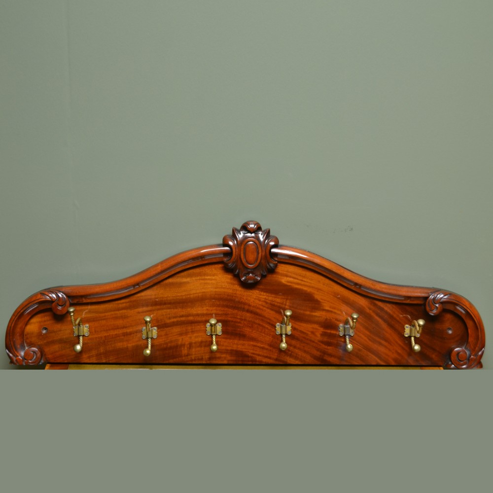 Victorian Brass Hooks on Beautifully Figured Mahogany Board
