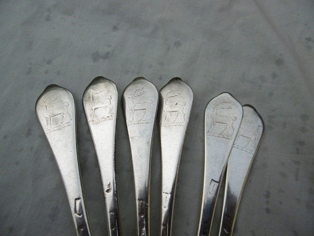 A set of six 1706 Queen Anne sterling silver dognose tablespoons arranged inside a velvet-lined wooden case. View V