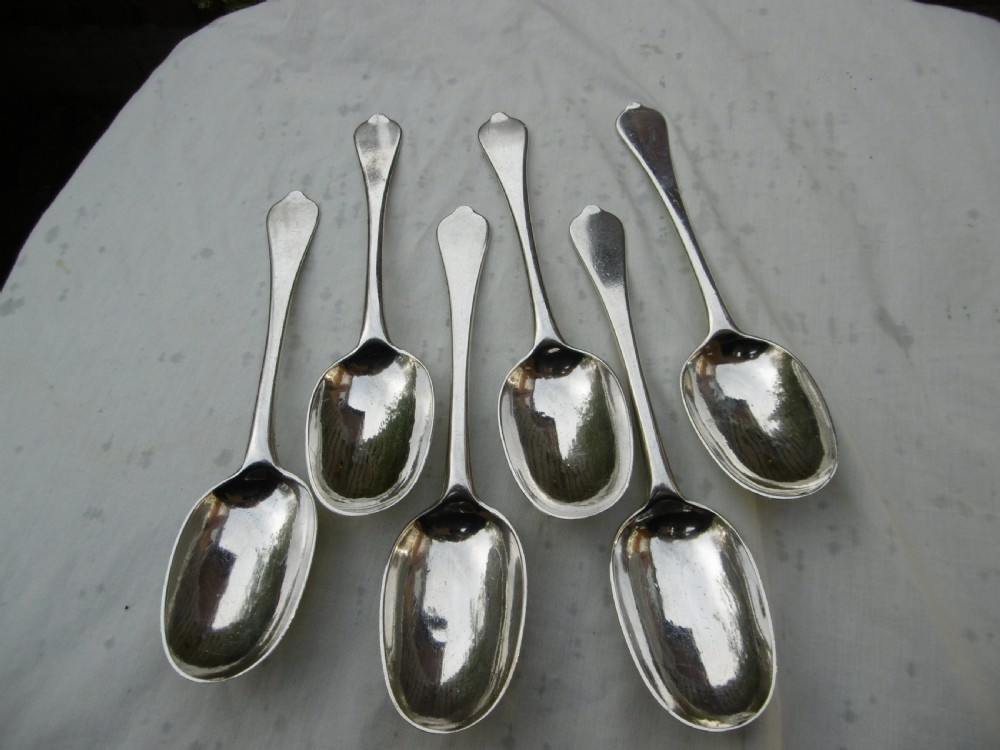 A set of six 1706 Queen Anne sterling silver dognose tablespoons arranged inside a velvet-lined wooden case. View VI
