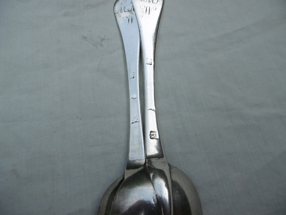A pair of 1706 Scottish Queen Anne sterling silver dognose tablespoons featuring rat-tail bowl supports and engraved initials on the handle terminals. View II