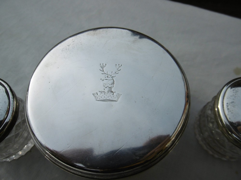 A five-piece Georgian sterling silver and cut glass dressing table set featuring engraved stag crests on silver lids. View III