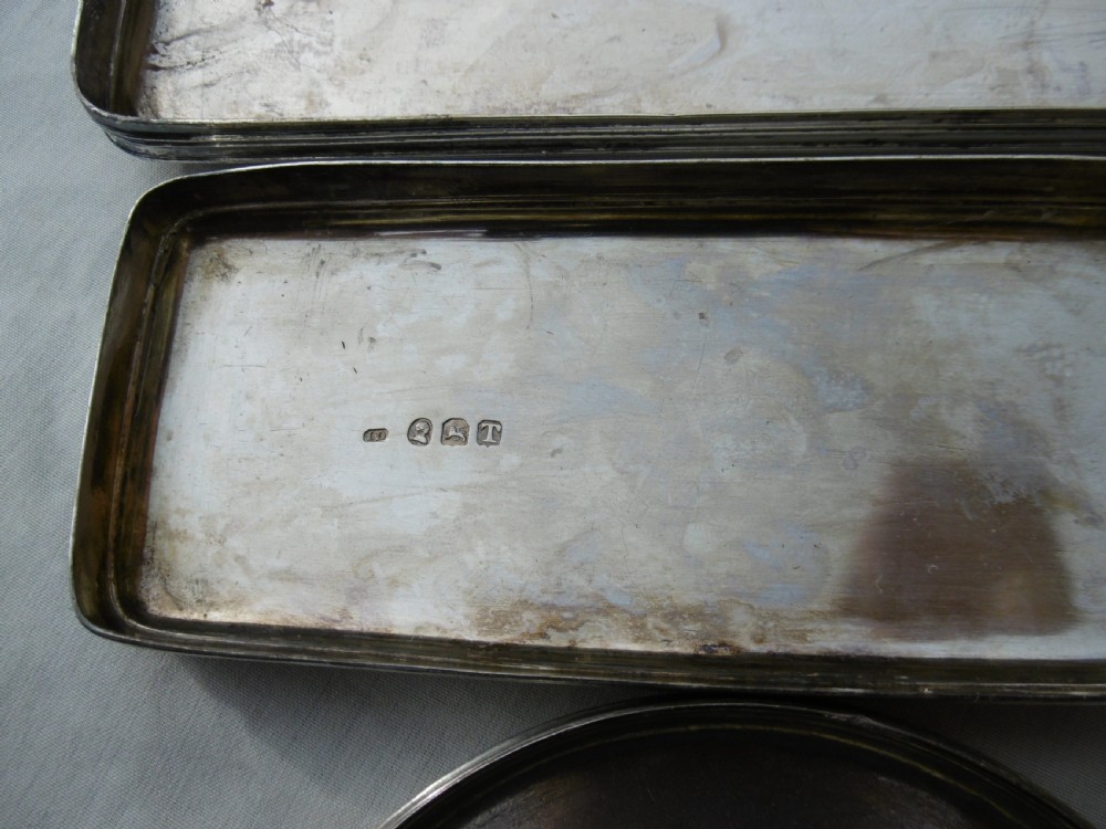 A five-piece Georgian sterling silver and cut glass dressing table set featuring engraved stag crests on silver lids. View VII