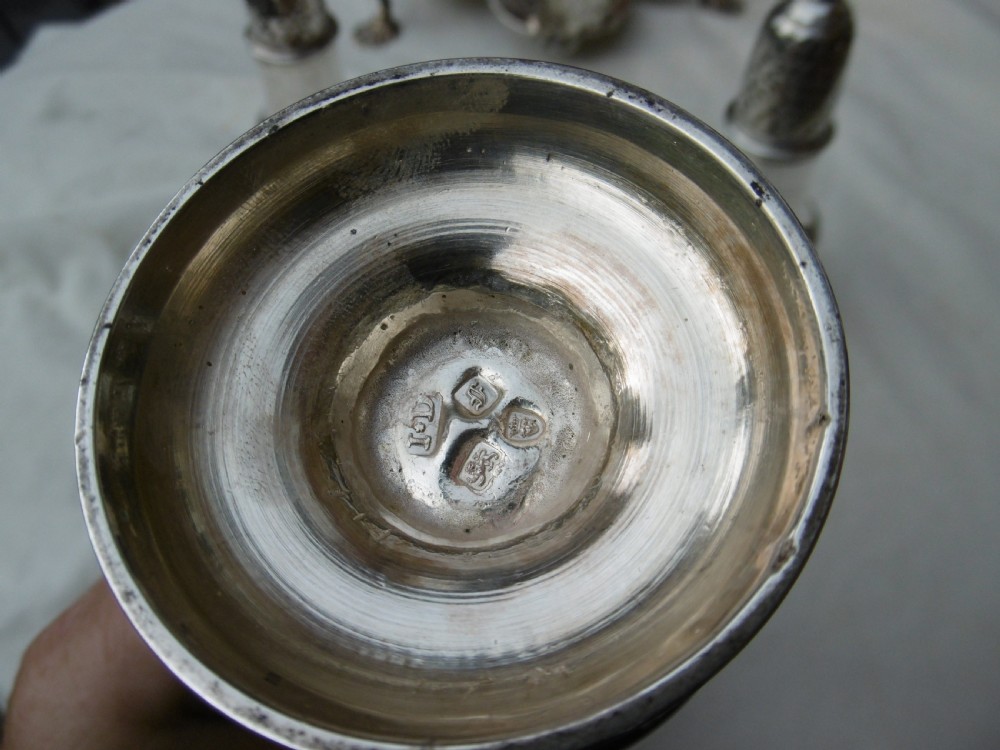 An 18th-century Georgian sterling silver Warwick cruet frame holding silver casters and cut glass bottles set upon shell-form feet. View VII