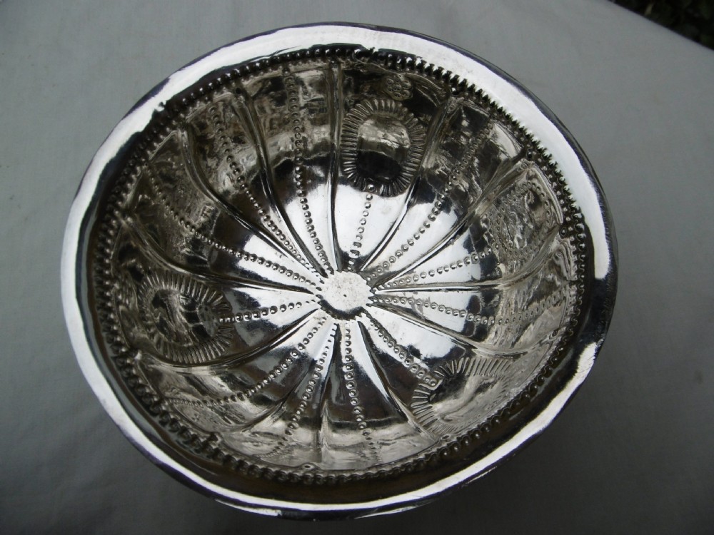 An antique George II sterling silver footed bowl featuring fluted sides, bead details, and shell-motif legs. View III