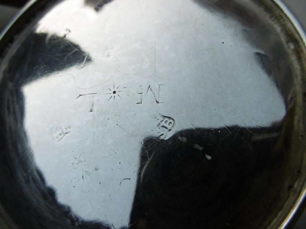 A George I silver brandy pan featuring a flared rim, plain cylindrical body, and a long turned dark wood handle. View IV