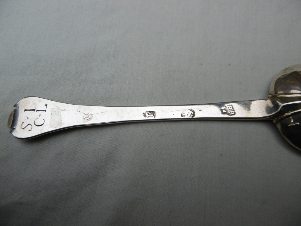 A seventeenth-century sterling silver Charles II trefid spoon featuring a notched terminal and an oval bowl. View II