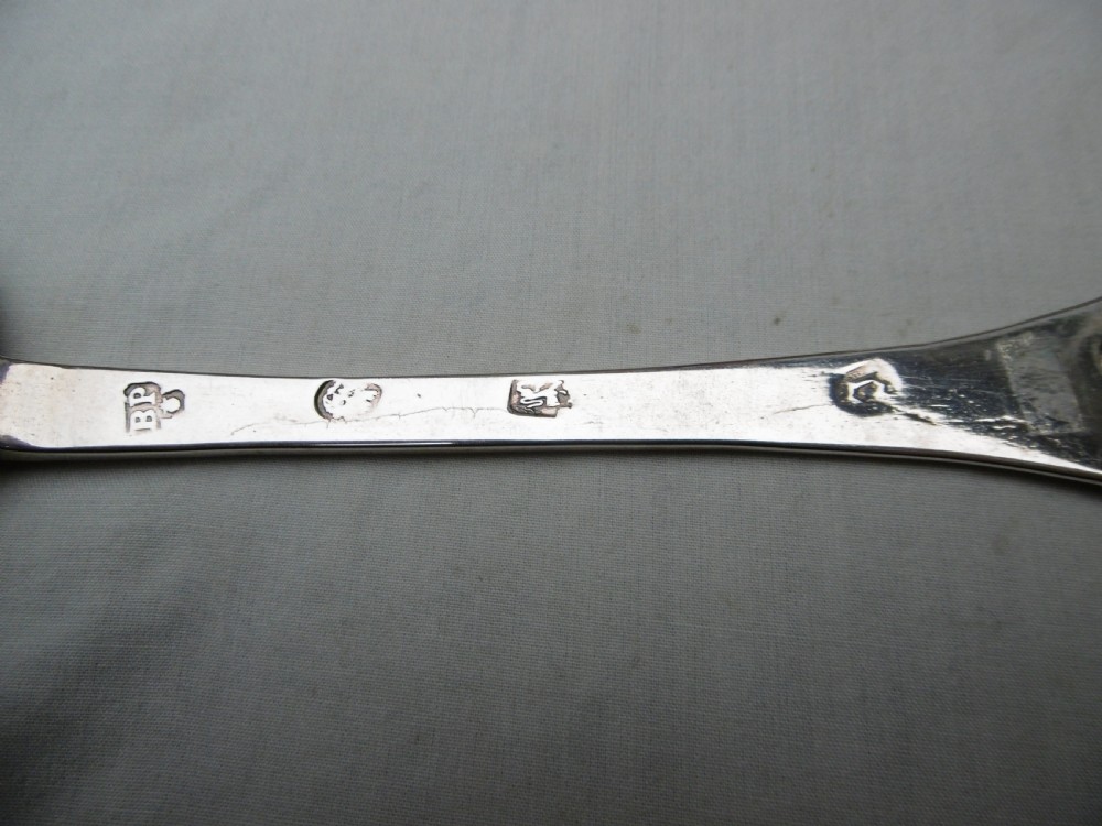 A seventeenth-century sterling silver Charles II trefid spoon featuring a notched terminal and an oval bowl. View IV