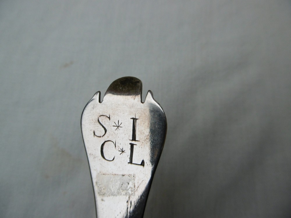 A seventeenth-century sterling silver Charles II trefid spoon featuring a notched terminal and an oval bowl. View V