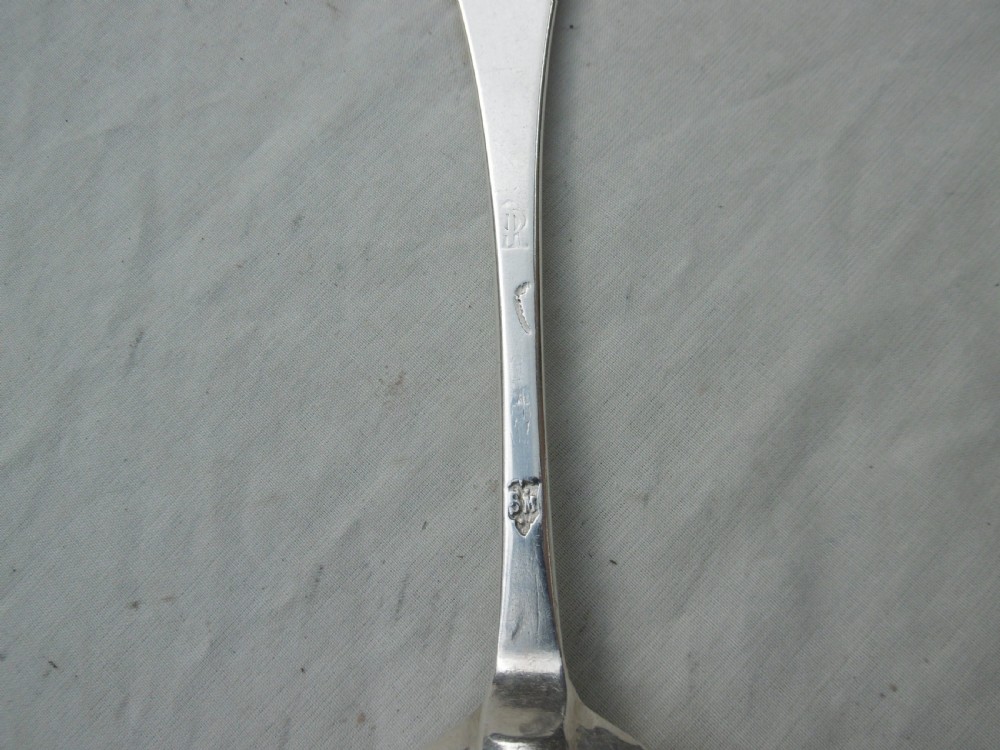 An antique 1702 Queen Anne silver dognose spoon with engraved initials on the handle and a rat-tail join on the reverse of the oval bowl. View III