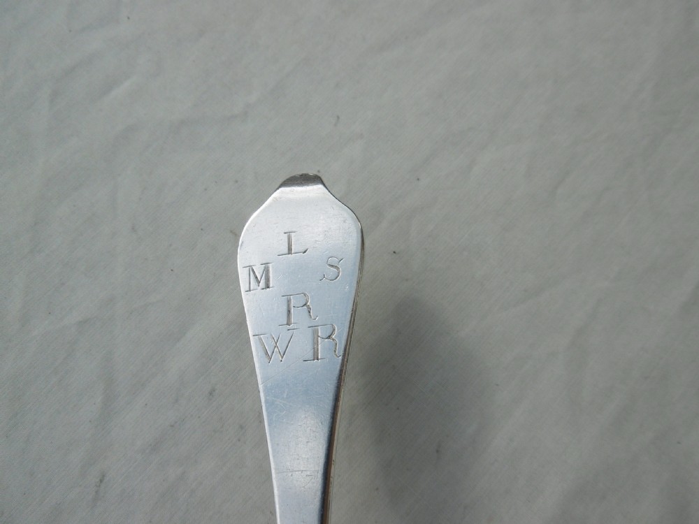 An antique 1702 Queen Anne silver dognose spoon with engraved initials on the handle and a rat-tail join on the reverse of the oval bowl. View IV