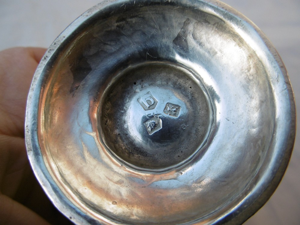 A George II sterling silver cream jug featuring a baluster body, sparrow beak spout, loop handle, and circular pedestal foot. View III