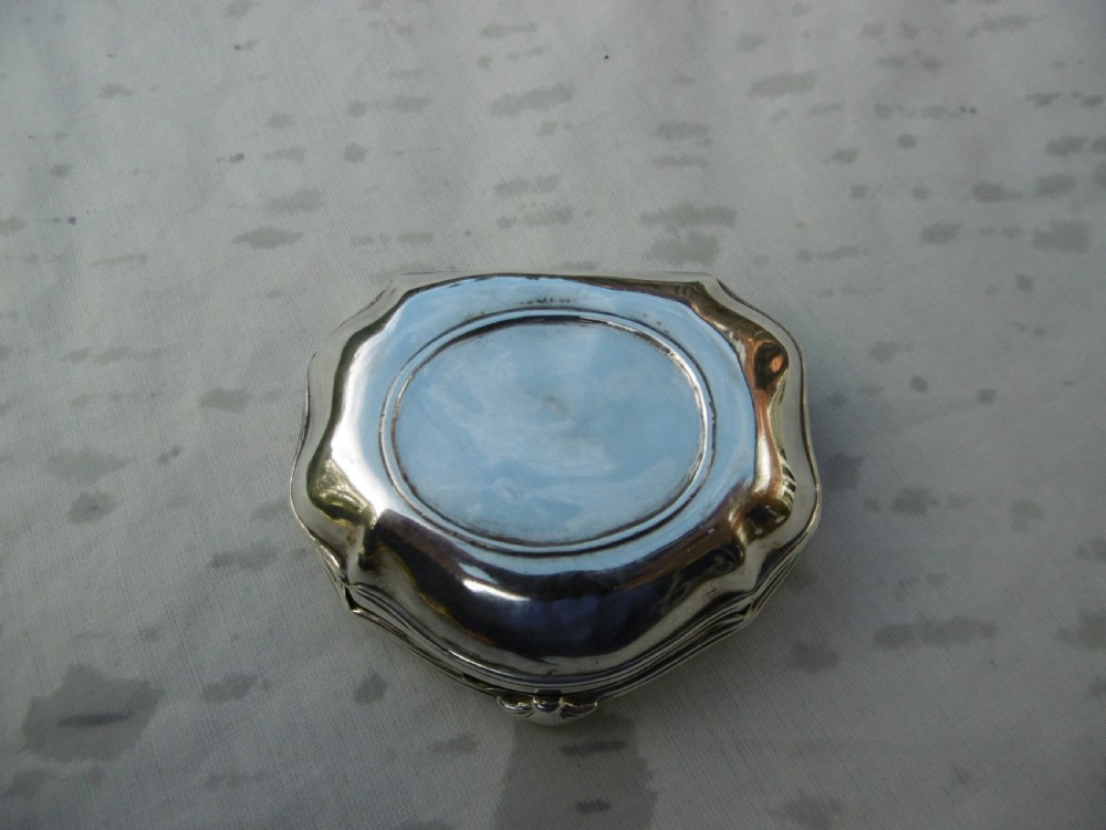 An eighteenth-century silver snuff box featuring an embossed mythological relief of Neptune on the hinged lid. View III
