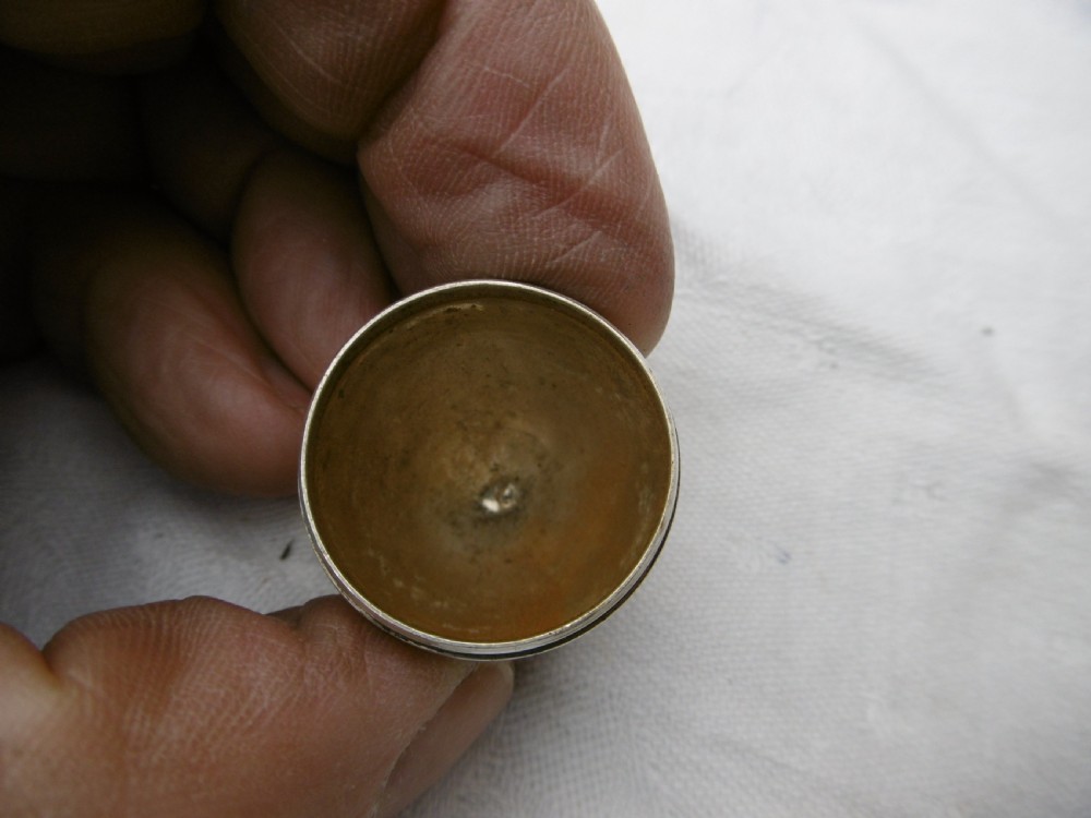 A three-piece antique Georgian sterling silver acorn-shaped nutmeg grater shown unscrewed alongside its circular steel grater plate. View III