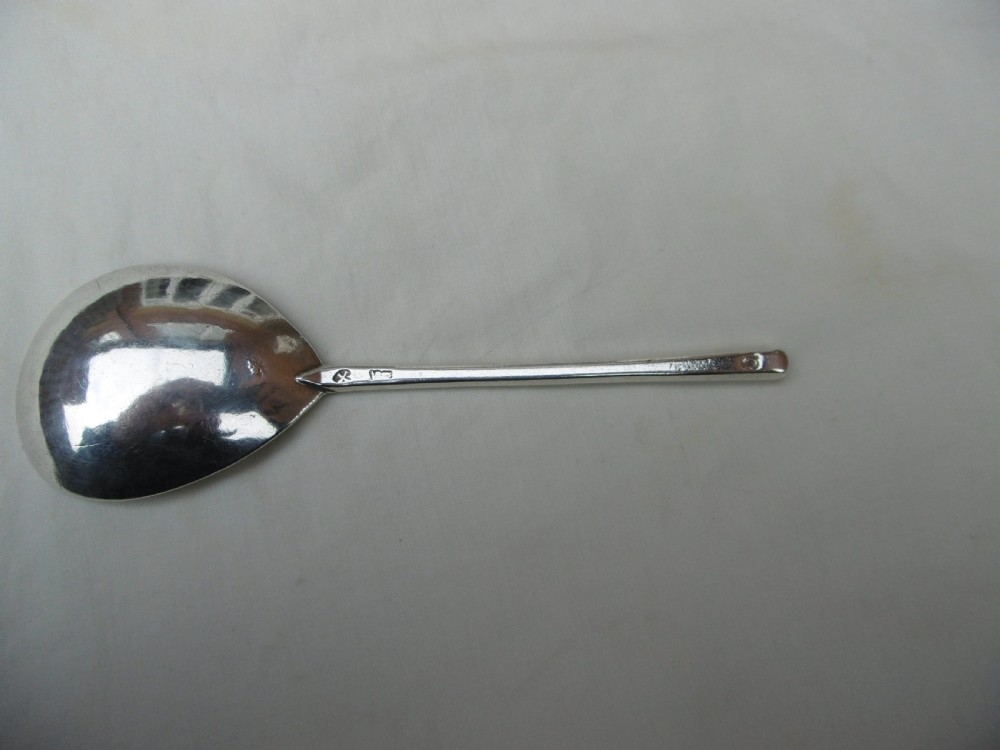 A 17th-century sterling silver slip top spoon displaying a wide fig-shaped bowl and a tapered hexagonal stem. View III