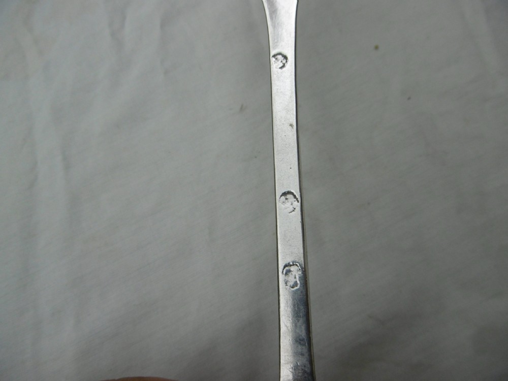 An antique silver dognose tablespoon featuring a rounded oval bowl with a rat-tail stem connection and hallmarks along the narrow handle. View III